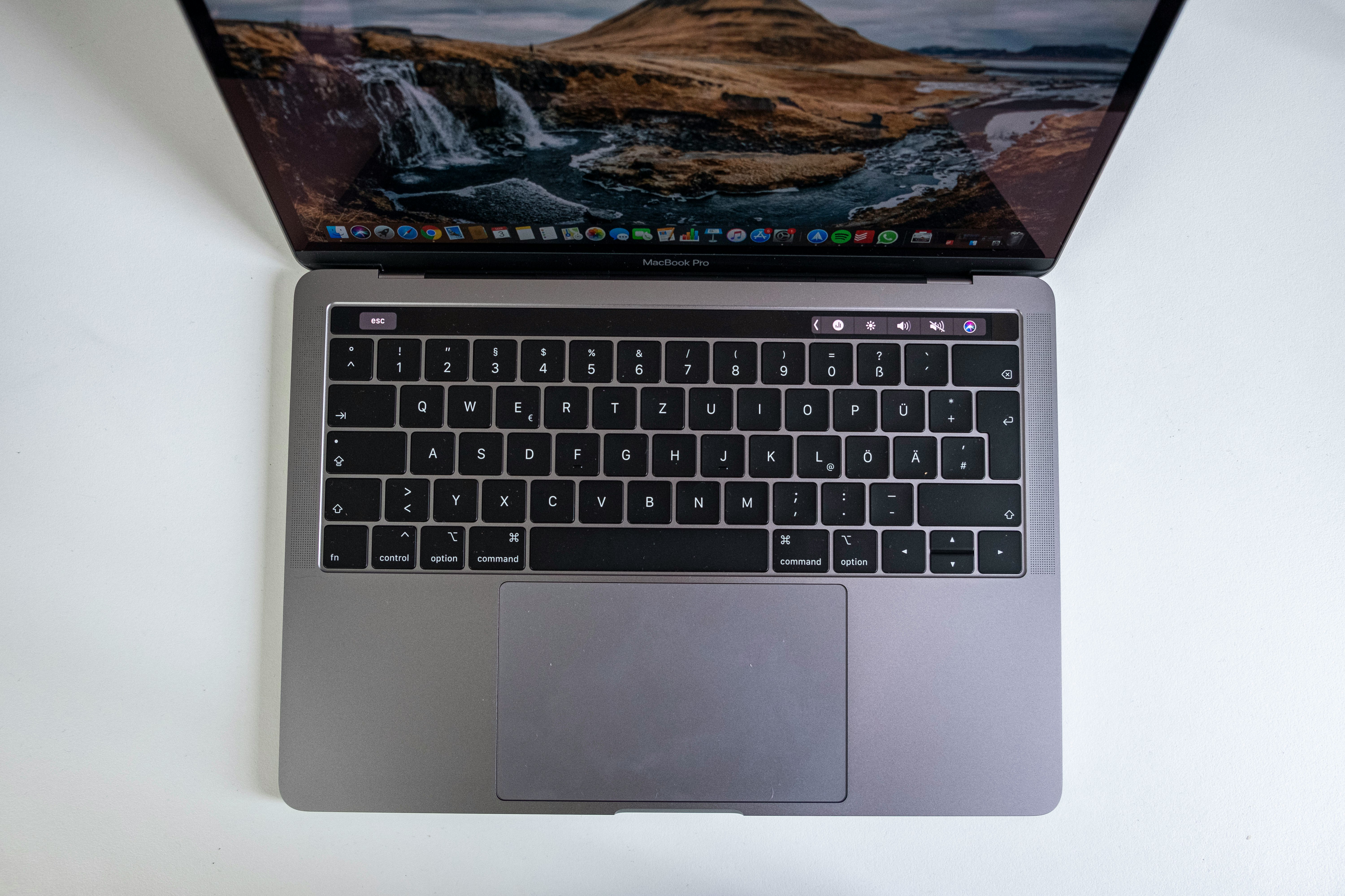 macbook pro on white table